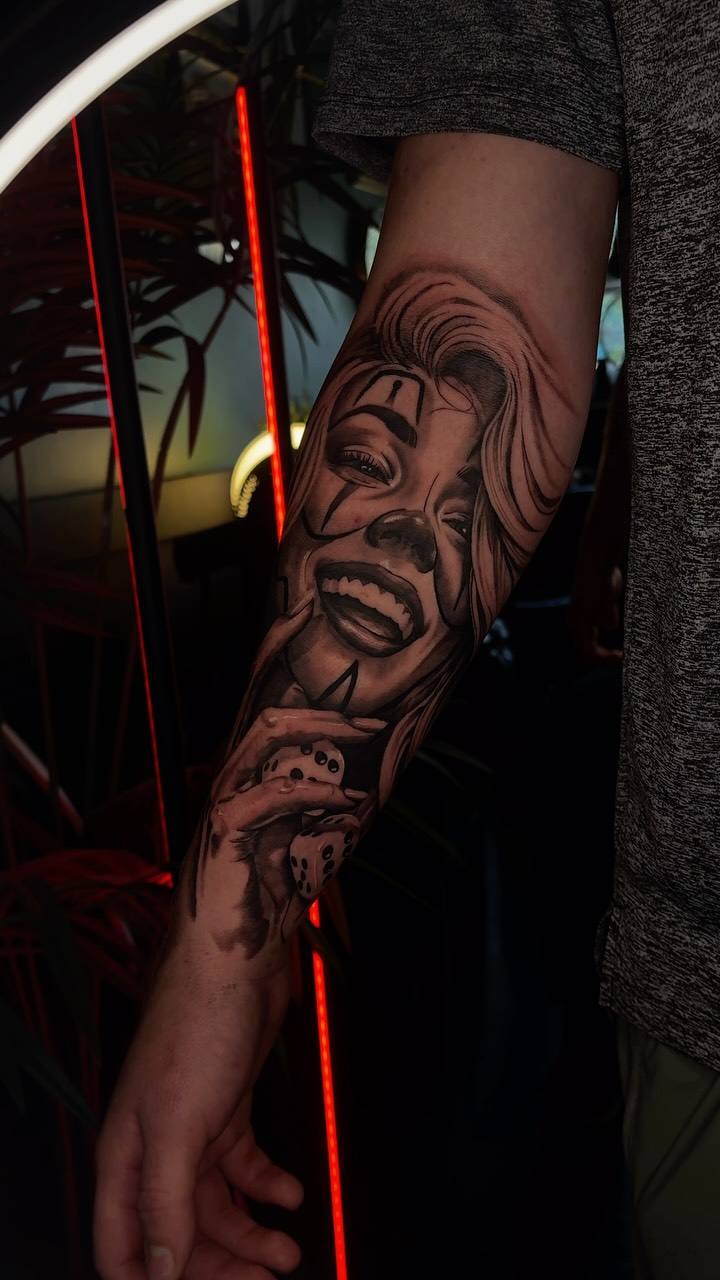 Laughing clown woman on a forearm