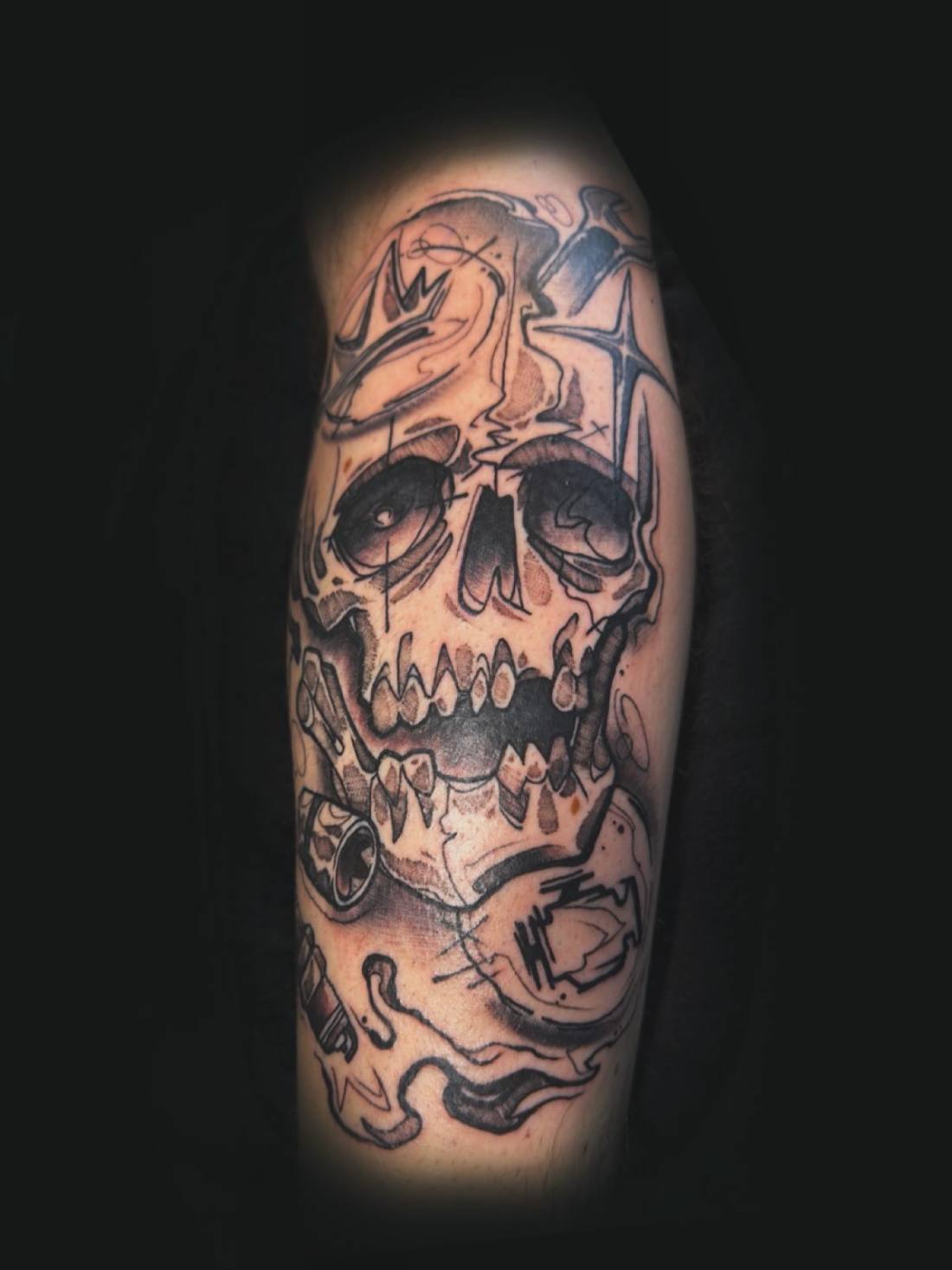 Skull with flames on a forearm
