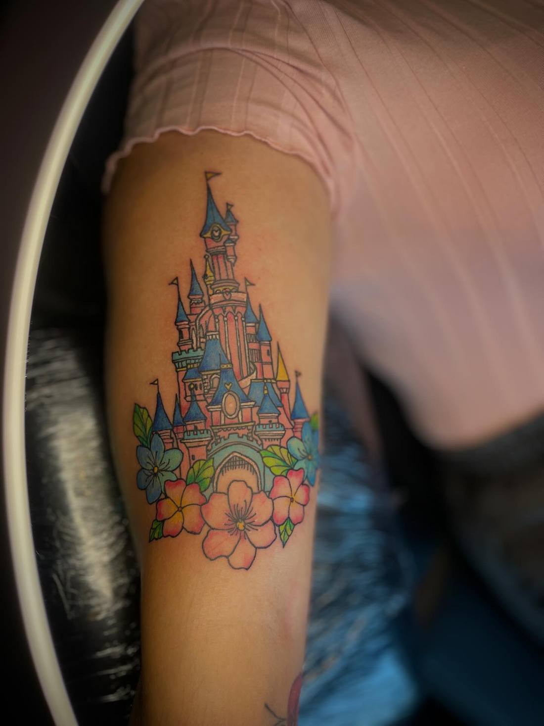Colourful castle with flowers on a forearm