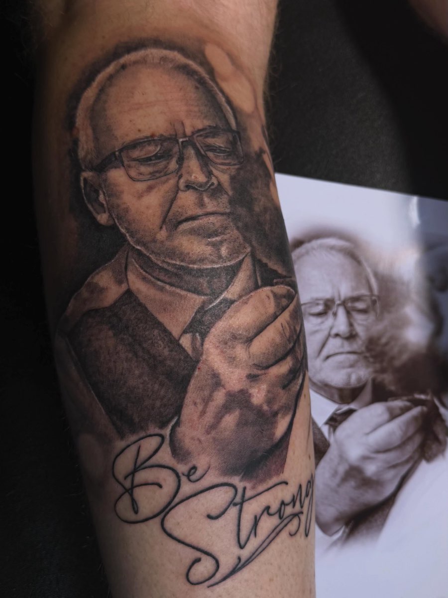 Realistic portrait tattoo of an older man, shown next to the reference photo
